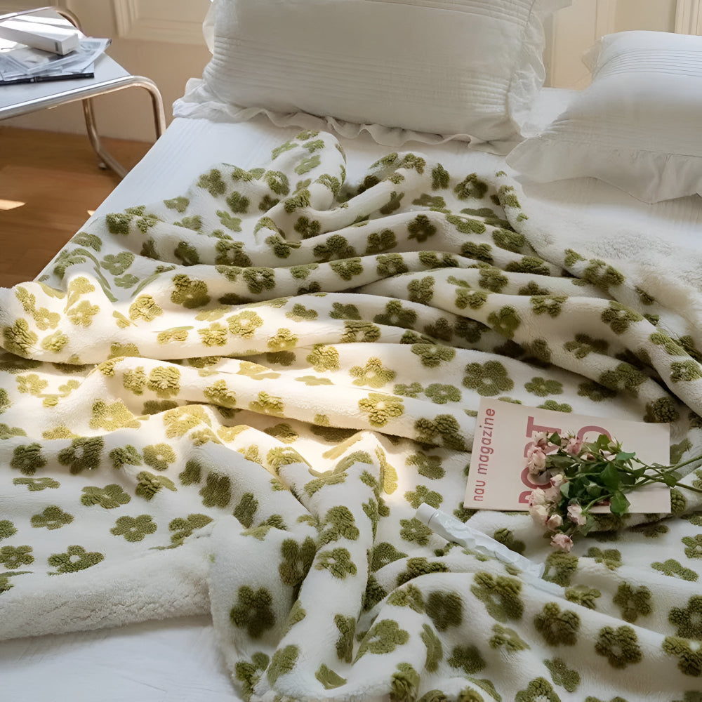 Blødt tæppe med retro blomstermotiv i 3D over en seng