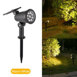 Solcellelampe med 9 LED lyser op i en have om aftenen