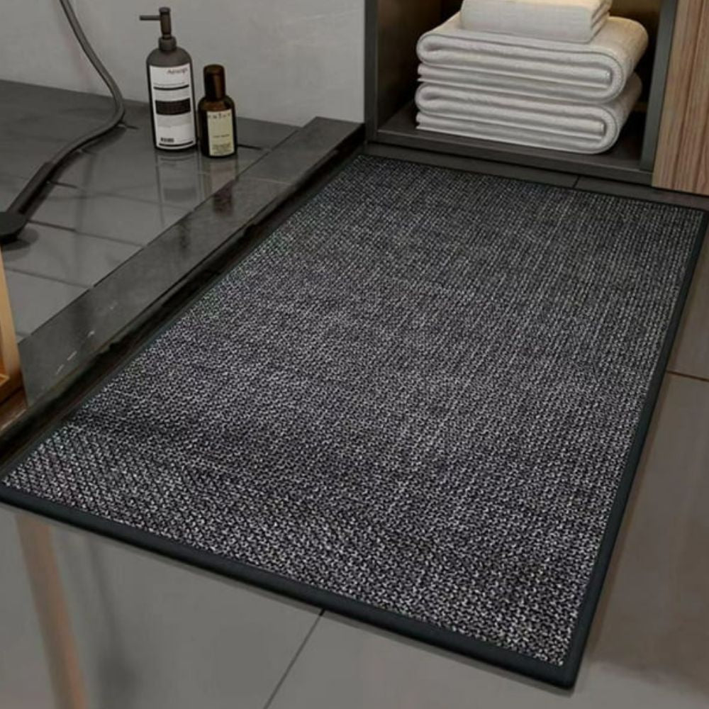 Skridsikker bademåtte i flettet design med gummibund foran bruser