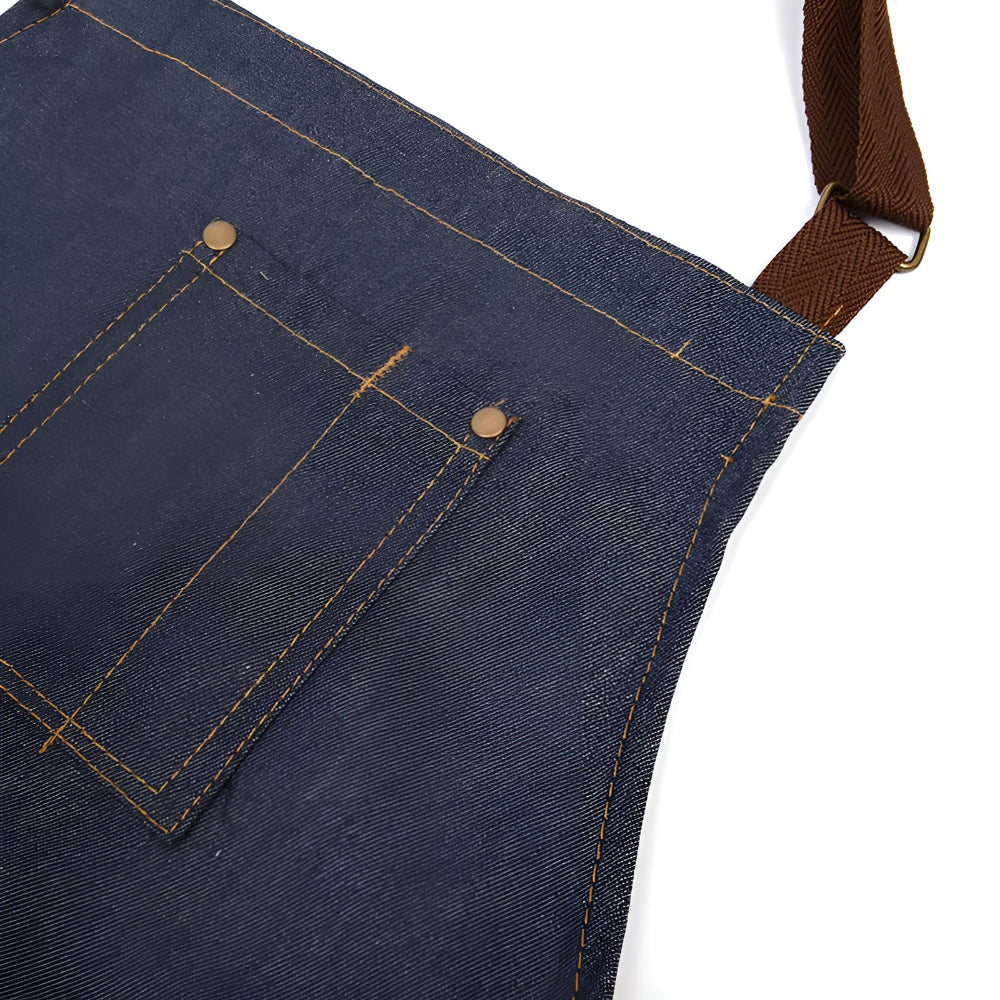 Justerbart blåt forklæde i denim med stor forlomme