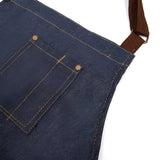 Justerbart blåt forklæde i denim med stor forlomme