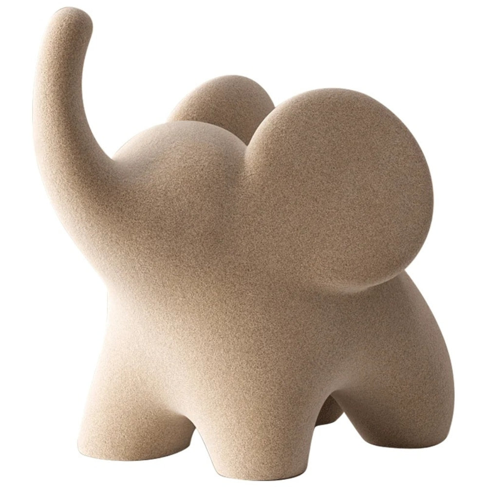 Minimalistisk elefantfigur i mat resin på en hylde