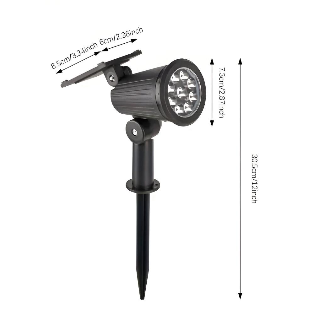 Solcellelampe med 9 LED lyser op i en have om aftenen