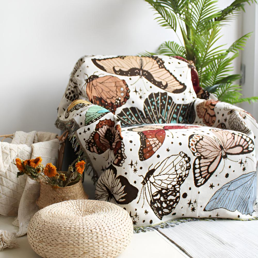 Farverigt plaid med sommerfuglemotiv og frynser