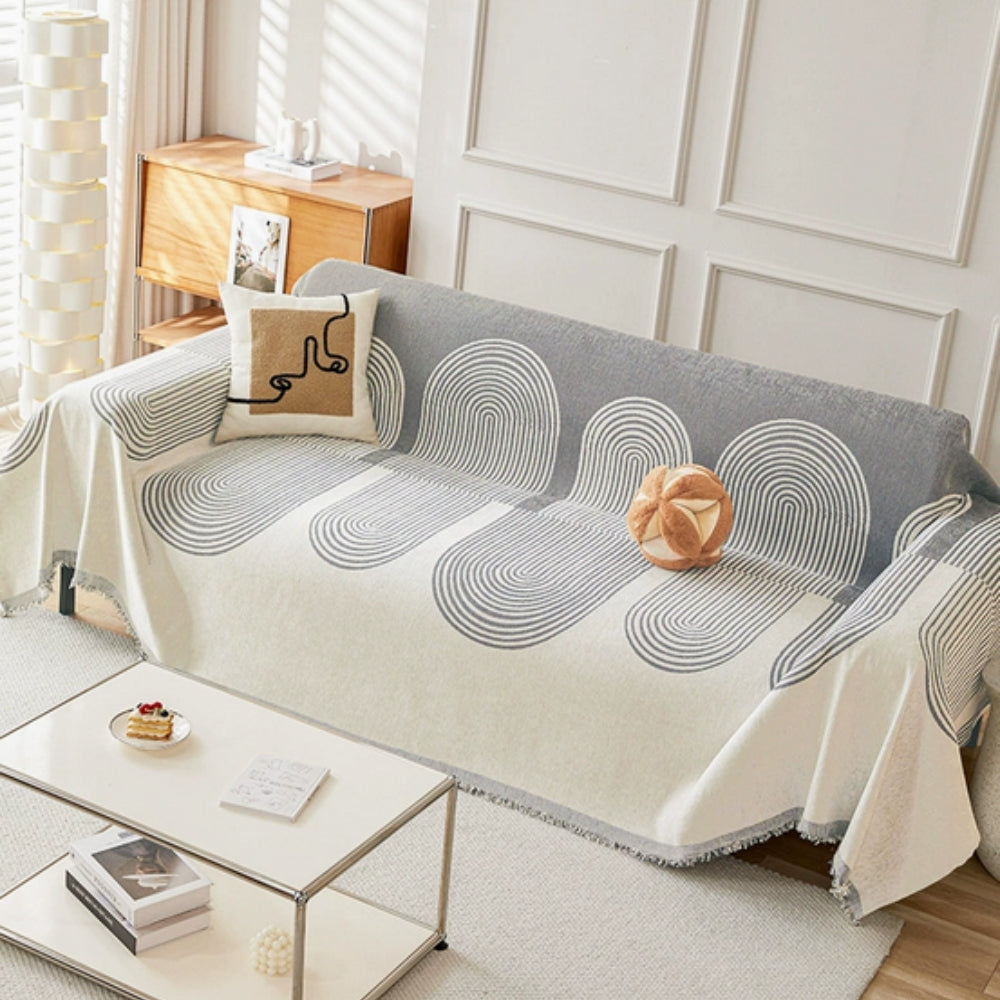 Dobbeltsidet chenille sofabetræk i boho-stil på en stue-sofa