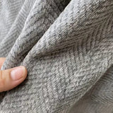 Vandafvisende sofabetræk i chenille med kvaster på sofa