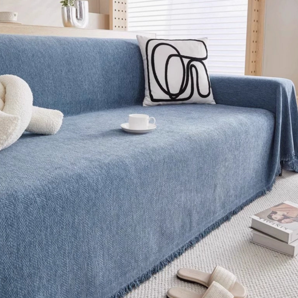 Vandafvisende sofabetræk i chenille med kvaster på sofa