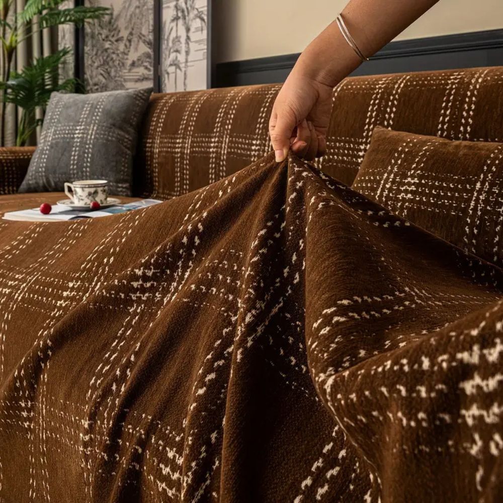 Ternet chenille sofabetræk med kvaster på 3-personers sofa i stuen