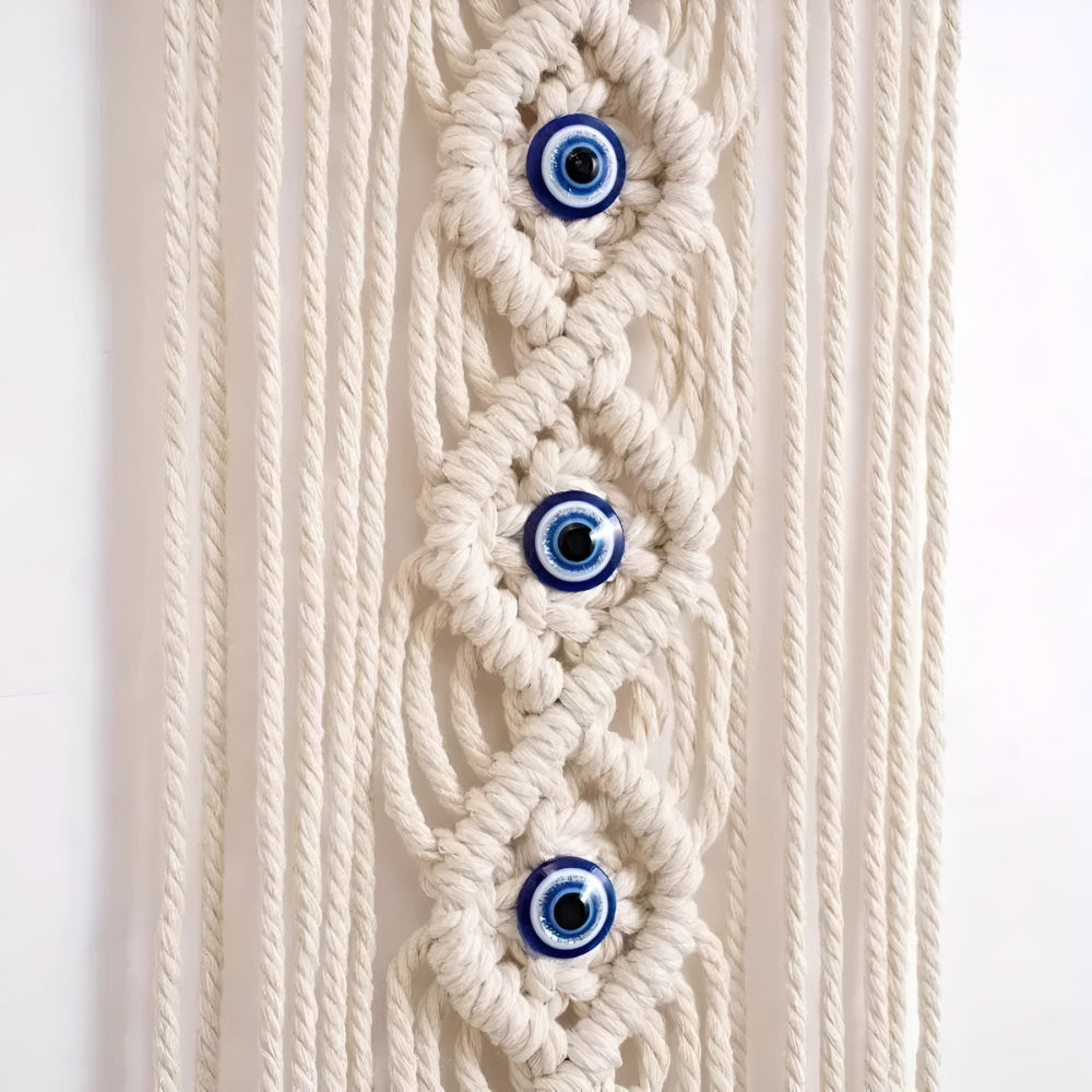 Boho makramé vægophæng i bomuld med perler formet som onde øjne