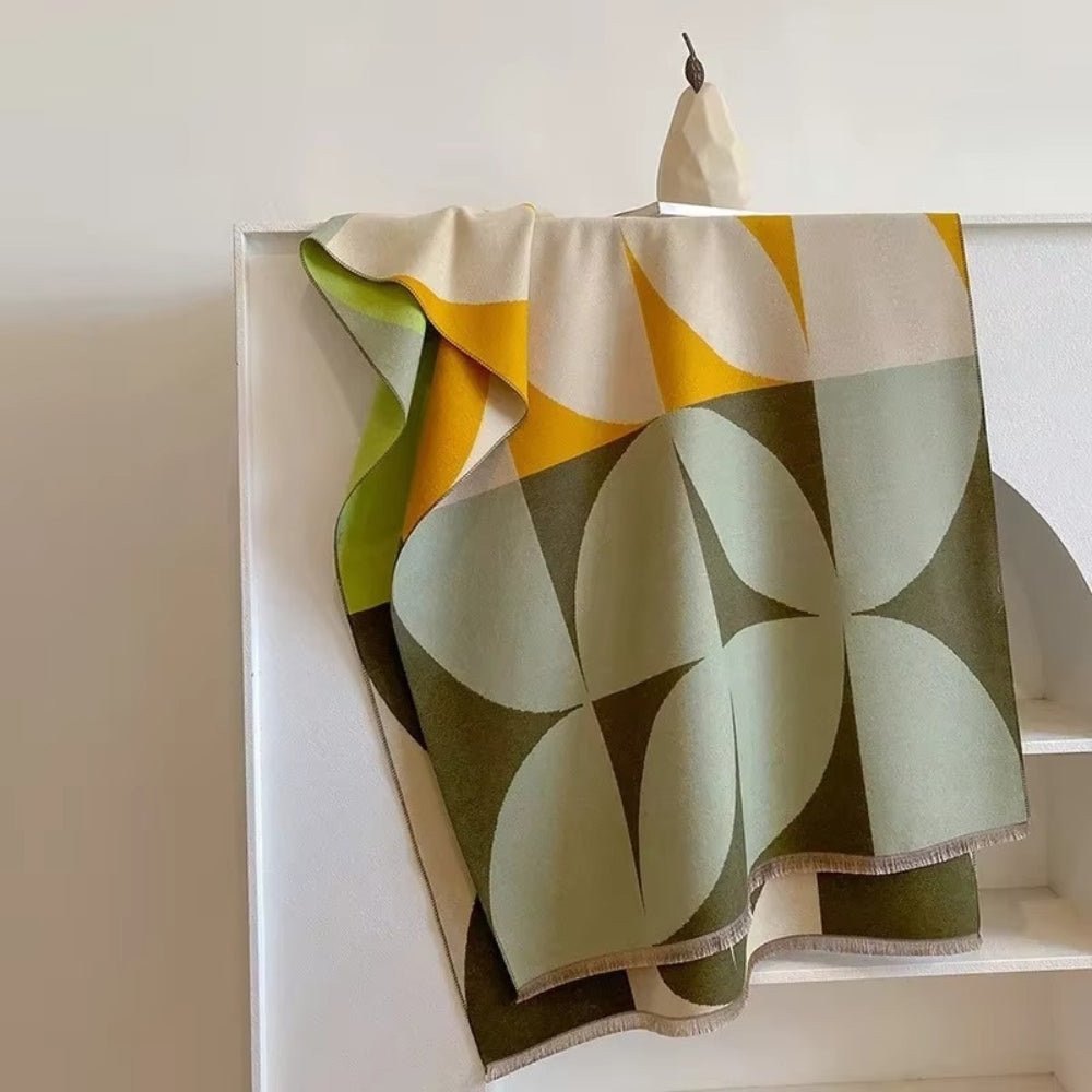 Vendbar poncho-tørklæde med geometrisk farveblok-mønster