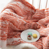 Dobbeltsidet fløjlsplaid med sherpa-fleece over sofa
