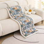 Ekstra tykt quiltet sofabetræk med bohemetryk på sofa