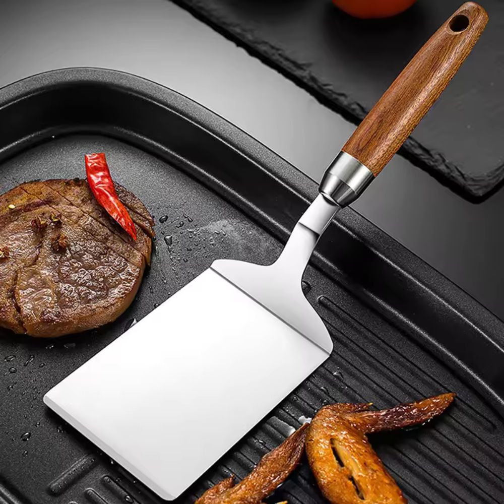 Stegespade i rustfrit stål med træhåndtag til køkken og grill