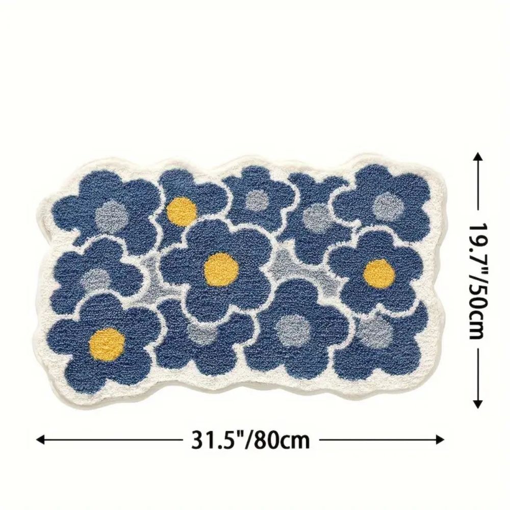Absorberende tuftet bademåtte med blomstermønster foran badekar
