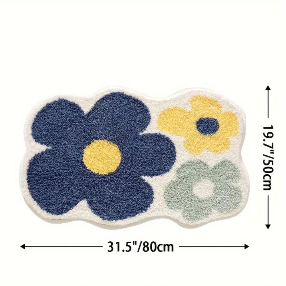 Absorberende tuftet bademåtte med blomstermønster foran badekar