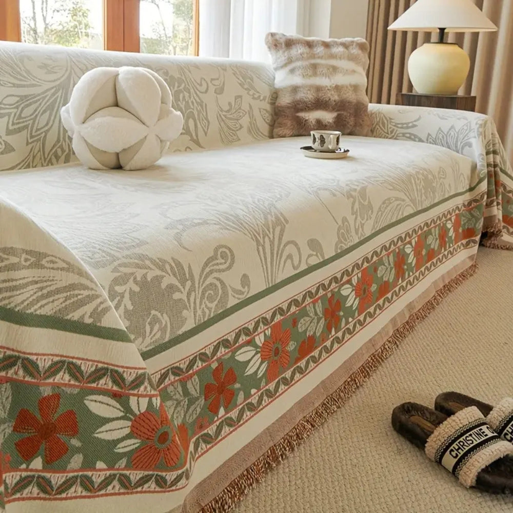 Boho sofabetræk i chenille med blomster og kvaster i jordfarver