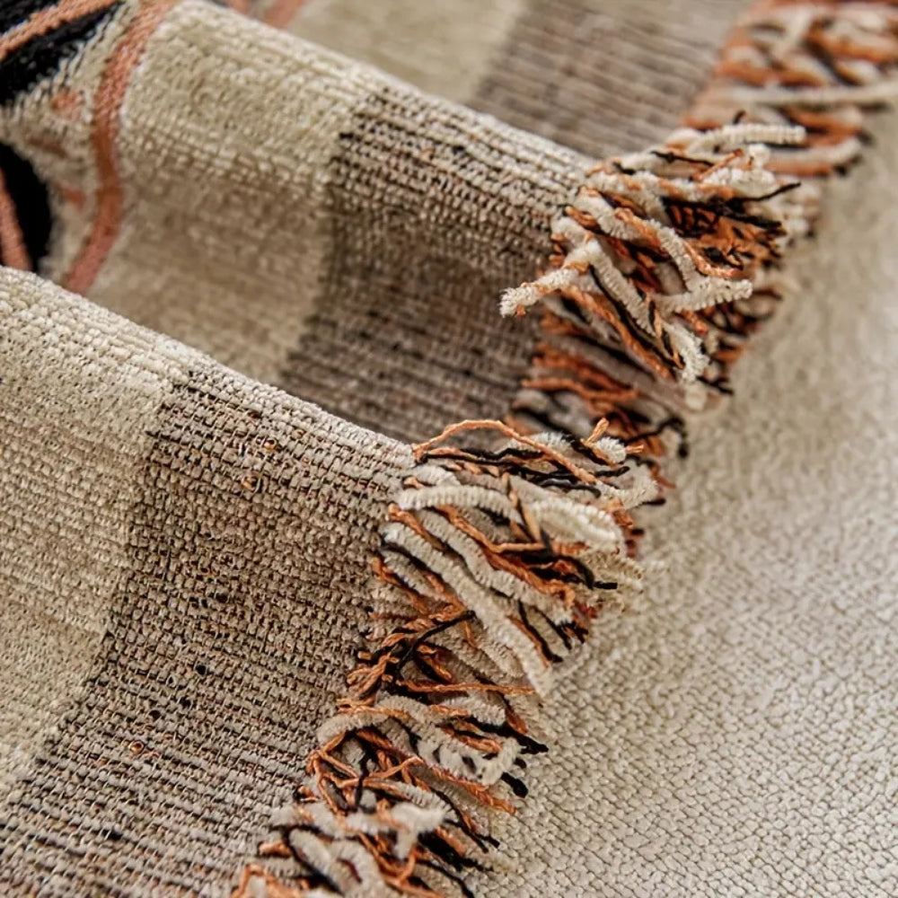 Boho sofabetræk i chenille med blomster og kvaster i jordfarver