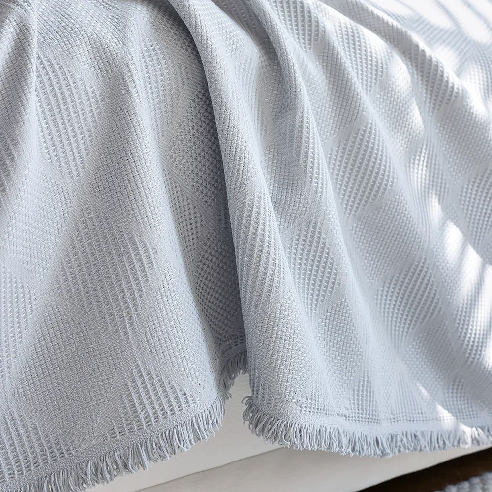 Sofabetræk i chenille med diamantmønster på sofa i stuen