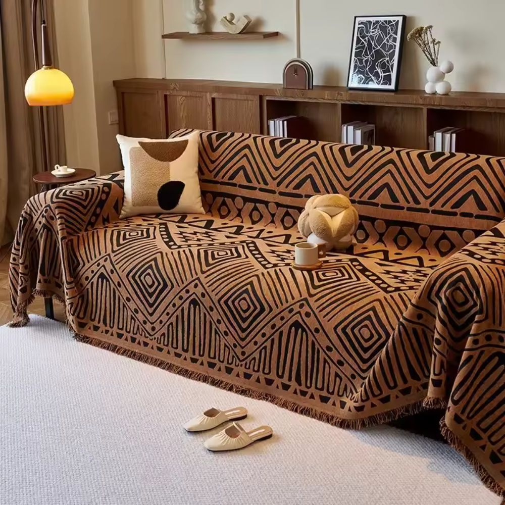 Vendbart sofabetræk i chenille med geometrisk print på sofa