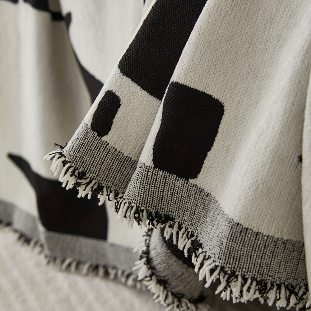 Vendbart boho sofabetræk i chenille med bølgestriber på sofa