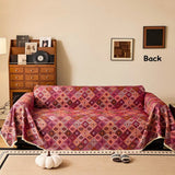 Sofabetræk i kilim-stil med geometrisk boho-mønster på sofa