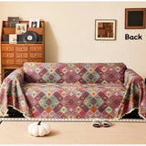 Sofabetræk i kilim-stil med geometrisk boho-mønster på sofa