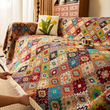 Sofabetræk i kilim-stil med geometrisk boho-mønster på sofa
